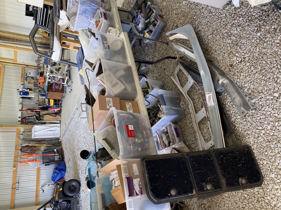 Car parts and storage bins in a garage