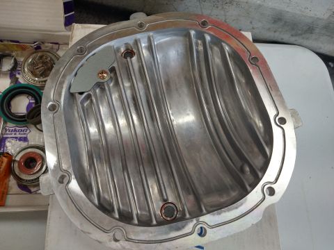 1996 Ford Bronco - Yukon Gear & Axle parts kit alongside an aftermarket aluminum differential cover.