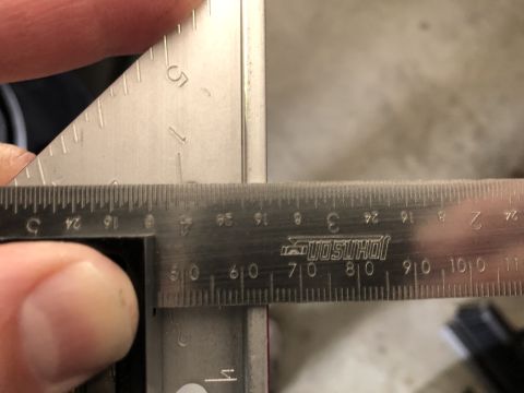 2019 Ford Everest - Using a caliper and ruler to measure a part. Johnson brand tool is visible.