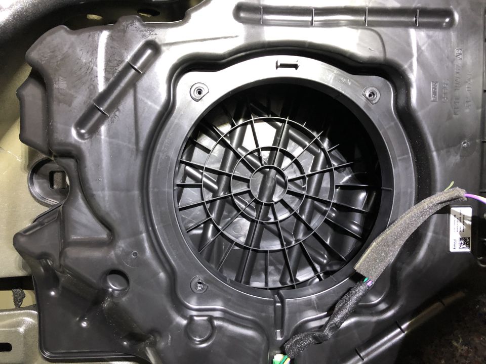Subwoofer housing with wiring and Supermotors logo