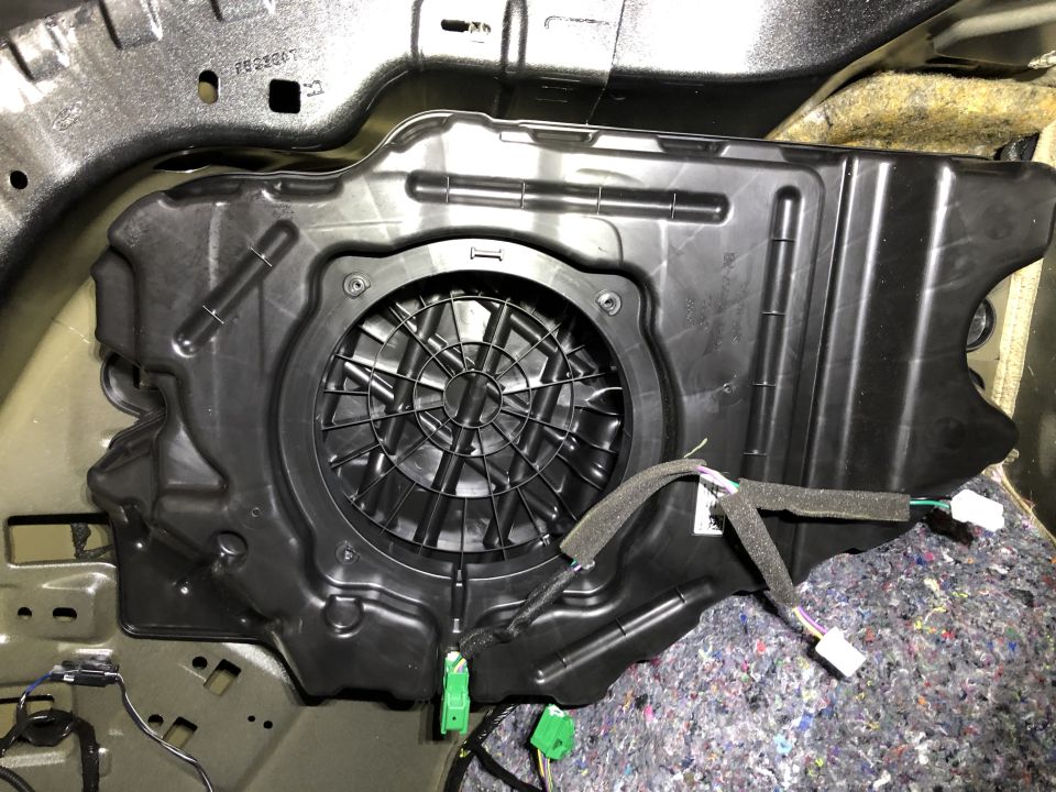 Car subwoofer enclosure with wiring harness connected