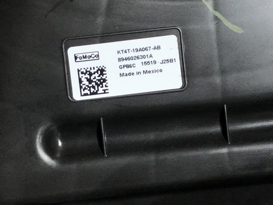 Close-up of a Ford part label with part number KT4T-19A067-AB and "Made in Mexico" text