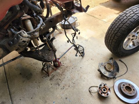 2003 Ford Ranger - The right outer CV boot is torn & twisted, so that side came apart. I'm sandblasting & painting most of the parts that come off. IF THE IMA…
