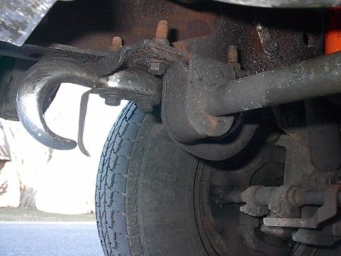 1986 Ford Bronco - Obviously, for the hooks, you'll need longer bolts than the closer(in photo) stock one holding in those new urethane sway bar bushings.