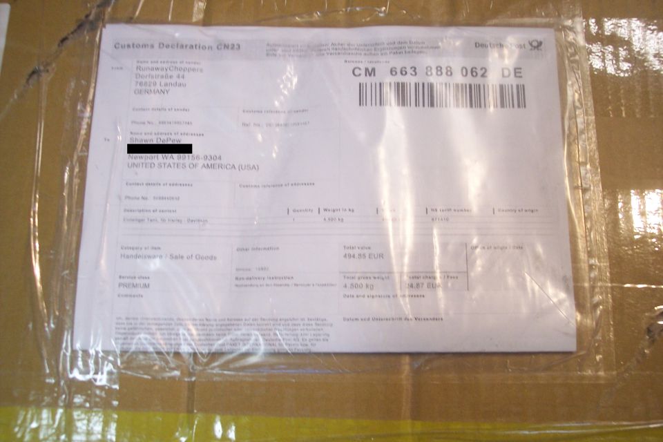 Customs Declaration CN23 form taped to a box.
