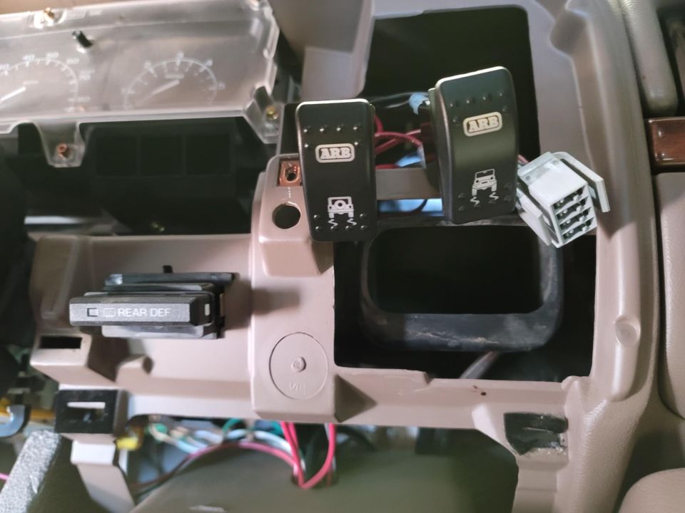 Dashboard with ARB switches for off-road traction control and a rear defroster button