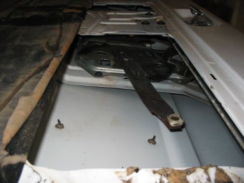 1995 Ford Bronco - paper backing peeled back to reveal motor arm. At this point I have already removed the glass.