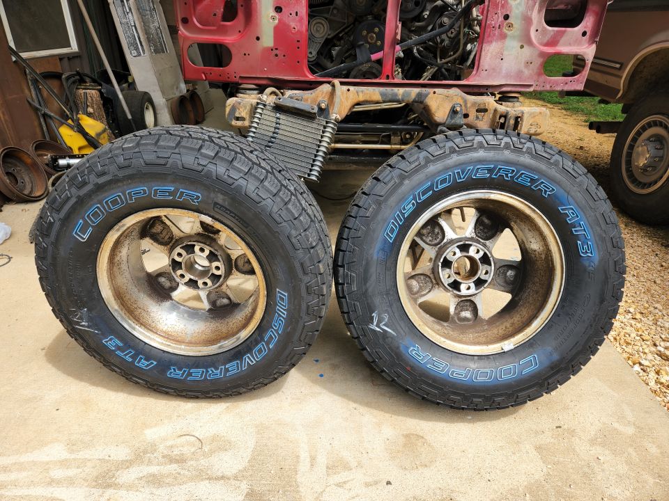 At the same time as the brakes, I tracked down a couple of used wheels, bought [url=https://www.amazon.com/dp/B07CZXBCLR]2 new tires (Cooper AT3 265/70R16)[/url], and had [url=https://www.amazon.com/dp/B073P3VMPX]TPMS[/url] sensors installed in the 4 road wheels. The previous spare (on a cheap steel wheel) is apparently the factory original because it's 20 years old. The other 3 previous tires (one blew apart when the wheel shattered) are severely flat-spotted from being deflated for a year. I hope they're not actually damaged, after they get rolling at highway speeds again.