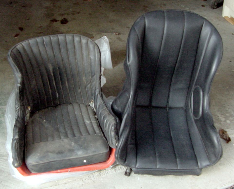 Two black bucket car seats, one older style, one modern