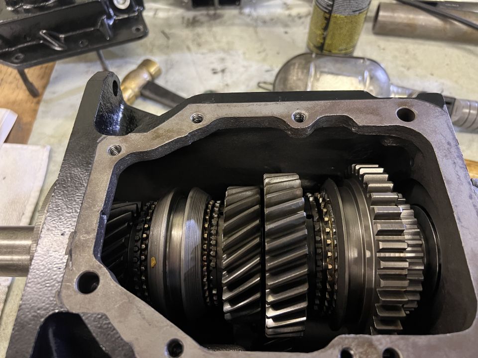 Open transmission housing showing multiple gears and shafts