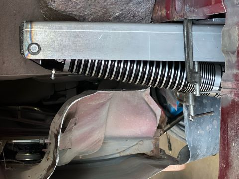 1995 Ford Bronco - Close-up of an aftermarket shock absorber assembly, likely a suspension upgrade part.