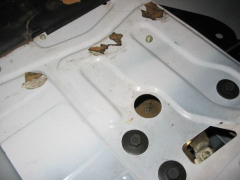 1995 Ford Bronco - underneath this rivet was an arm that went to the bottom of the tailgate, that the glass would rest on when fully in the tailgate. This is…