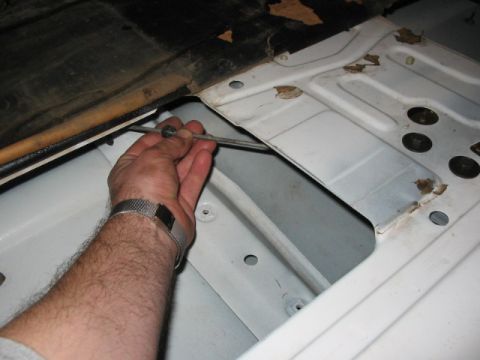 1995 Ford Bronco - And here is the arm. Once I took a grinder to the rivet and punched it out, the arm fell loose, and the safety mechanism was gone.