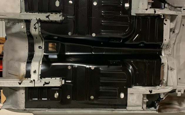 1967 Ford Mustang undercarriage, showing frame rails and floor pan