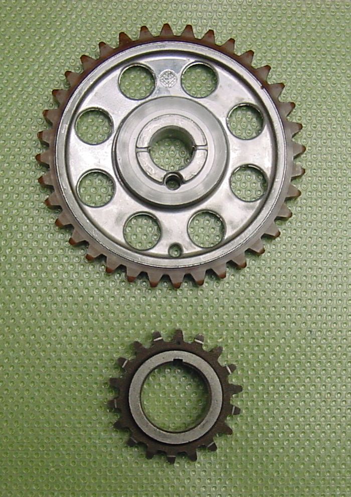 My original cam and crank sprockets which were replaced in 2022.  They were both in perfect condition. I could find no cracks or chips on the nylon teeth.  Full metal sprocket in the car now, along with new timing chain.
