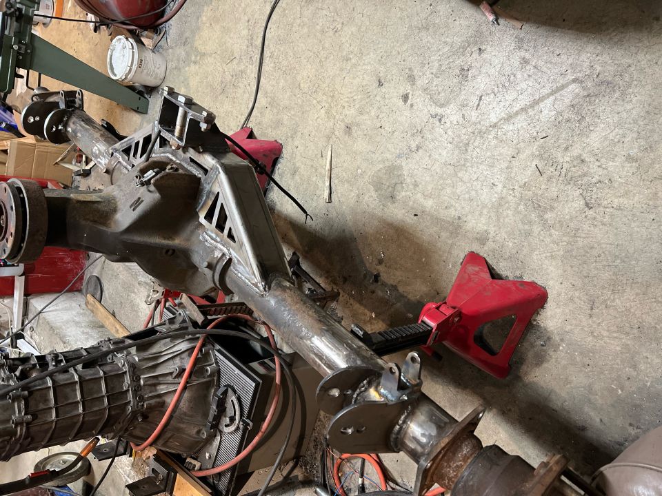 Custom fabricated differential housing and transmission assembly on jack stands