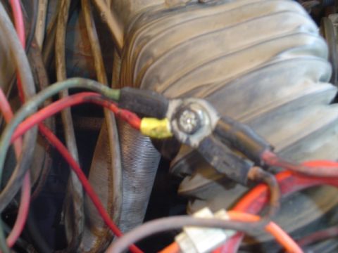 1979 Ford Bronco - A close-up view of the engine's wiring harness shows multiple wires connected to a terminal.