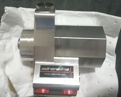 2001 Ford Excursion - A close-up view of a metal fuel pump with "Adrenaline" branding and a website address visible.