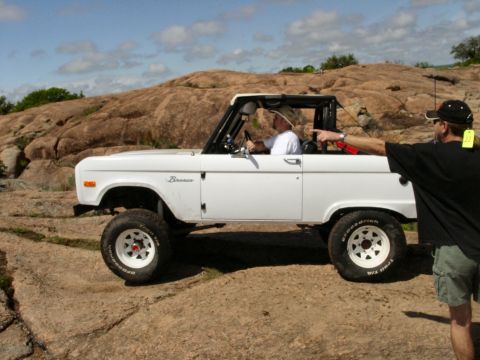 1973 Ford Bronco - A white 1973 Ford Bronco navigates a rocky terrain during the Katemcy Rocks Bronco Roundup.