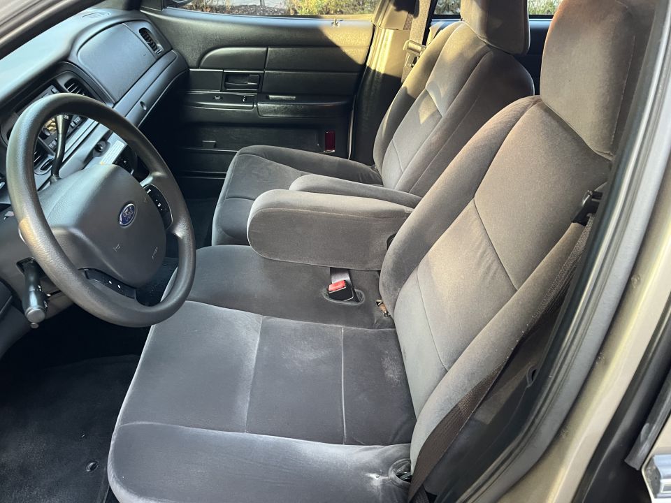 Front bench seat and dashboard interior of a Ford Crown Victoria
