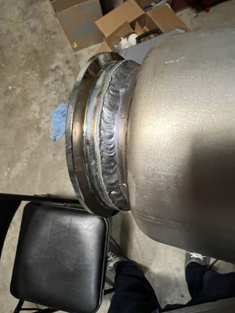 1981 Ford LTD - V band clamp welded to the resonators (bullet mufflers). Not exactly stacking dimes but not going to fall off.