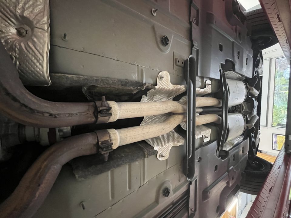 Undercarriage photo of exhaust crossover pipes and heat shields