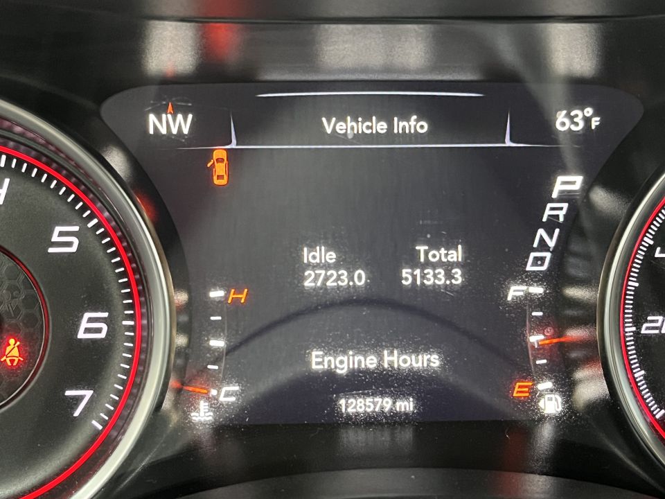 Photo of a digital instrument cluster showing engine hours and mileage