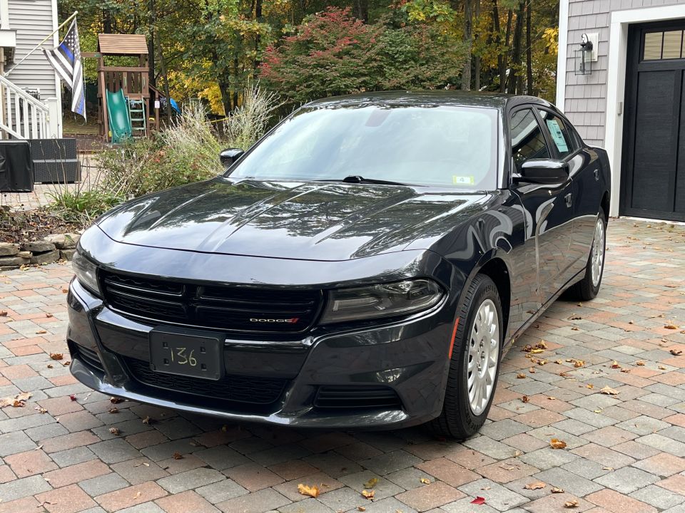 Front driver-side view of a black Dodge Charger