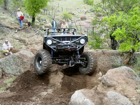 1973 Ford Bronco - Modified 1973 Ford Bronco tackles a rocky trail during an off-road event.
