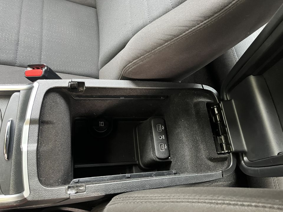 Open center console storage with USB ports in a Dodge Charger
