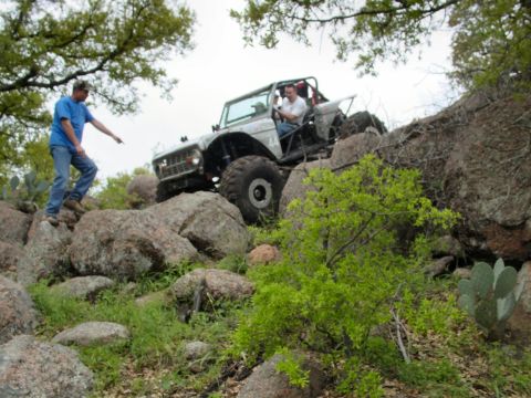 1973 Ford Bronco - Modified 1973 Ford Bronco navigating a challenging rocky trail.