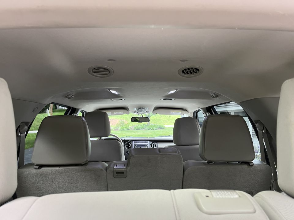 Interior headliner and rear seats viewed toward the front