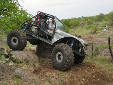 1973 Ford Bronco - This heavily modified 1973 Ford Bronco navigates a rocky trail during an off-road event.