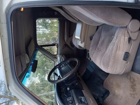 1994 Ford Bronco - View from the passenger side door into the driver's area of an SUV.