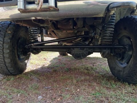 1994 Ford Bronco - Underside view of a 1994 Ford Bronco, showing its robust suspension and large tires.