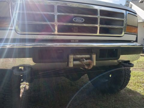 1994 Ford Bronco - Front view of a 1992 Ford Bronco, showing its grille, bumper, and winch.