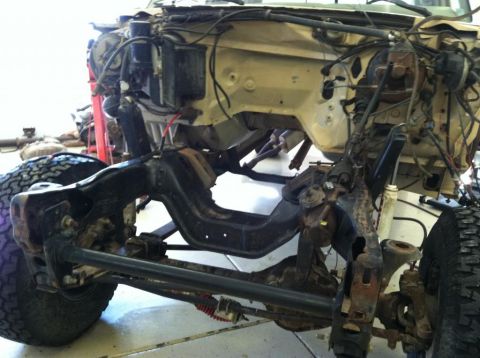 1985 Ford F-350 - Disassembled truck chassis with engine bay components visible, likely undergoing repair or modification.