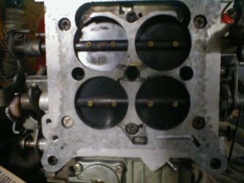 1967 Ford Mustang - Close-up view of a carburetor's internal components, showing the four throttle bores.