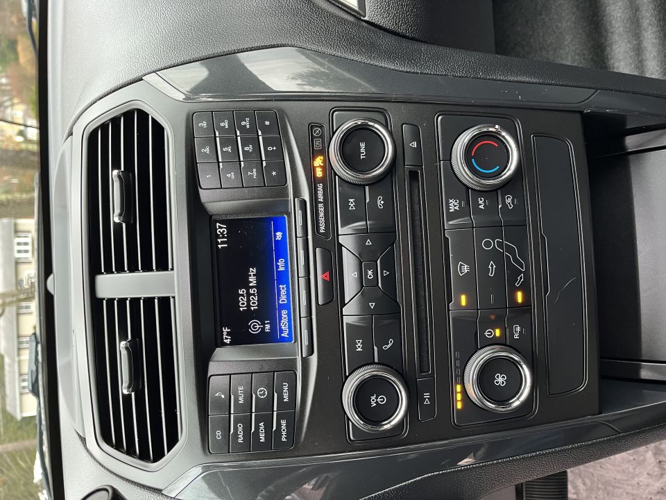 Center dashboard stack with radio display and climate controls