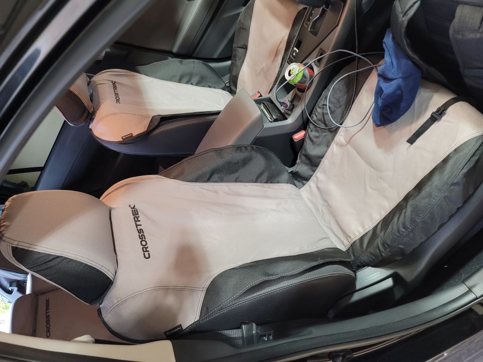 Interior of a Subaru Impreza with Crosstrek seat covers and center console.