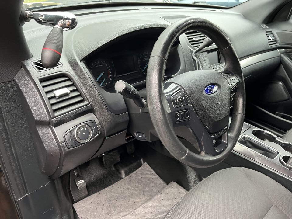 Steering wheel, column shifter, and dash of a fleet Ford SUV interior