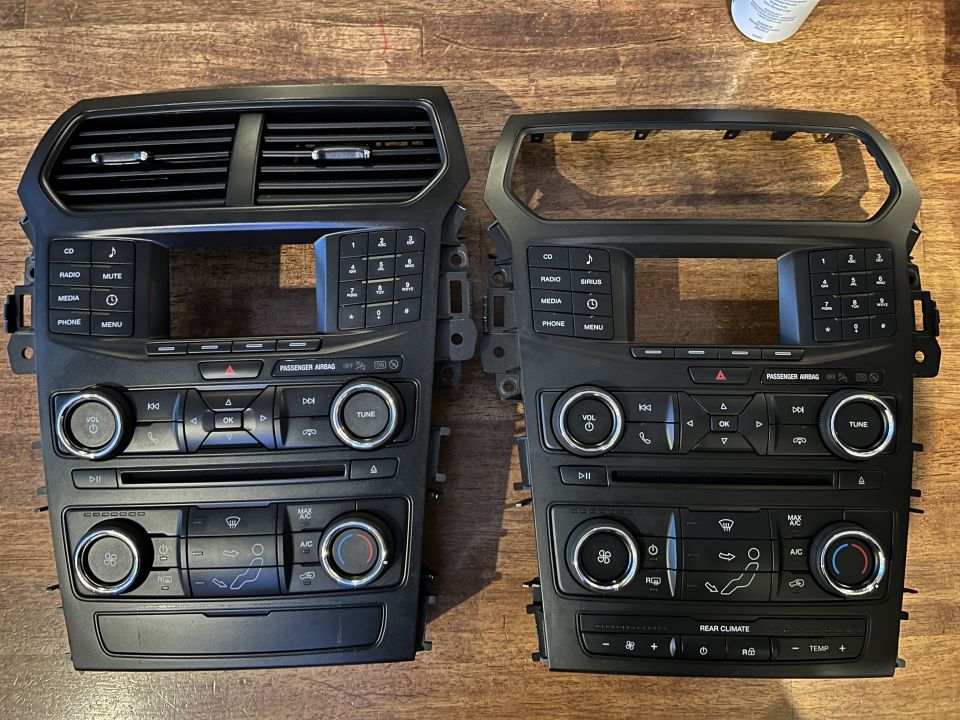 Two black radio climate control bezels with vents and HVAC knobs side by side