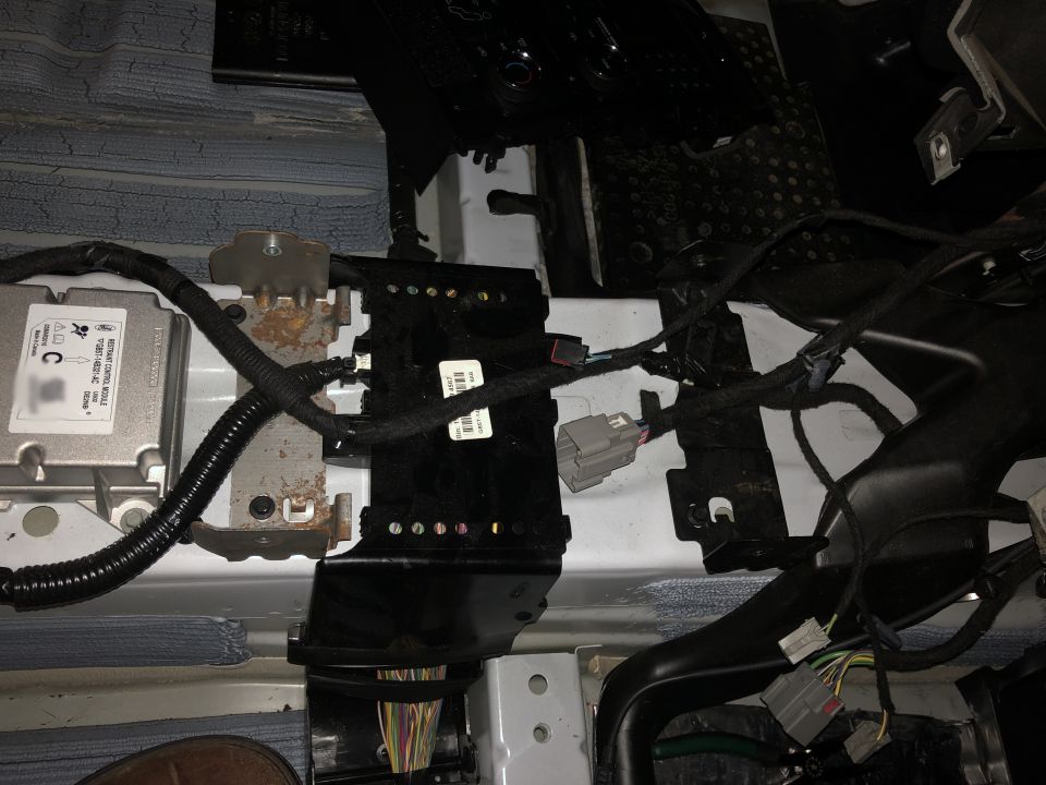 add the center console brackets and small bolts, fits without modifications.