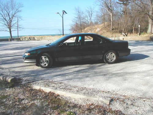 Dark green 1995 Dodge Intrepid parked by the water