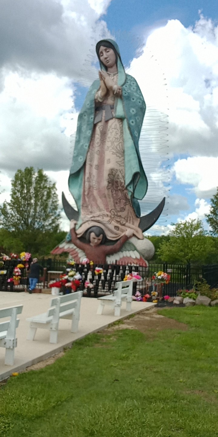 Large outdoor statue covered in colored ceramic mosaics of Our Lady of Guadalupe.  The largest representation of this in the world!