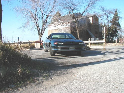 1995 Dodge Intrepid parked in front of an old building