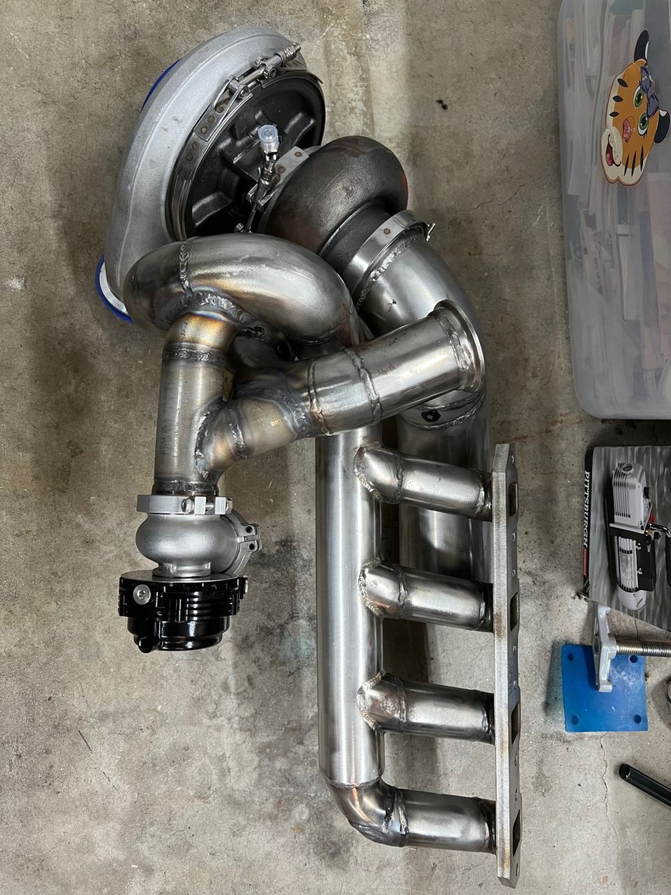 Put the turbo, header, and down pipe stub together to plan out the waste gate merge. I need to put it in the car to check clearance to the control arm though.