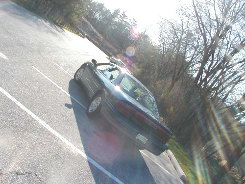 Dark 1995 Dodge Intrepid from rear, parked on asphalt