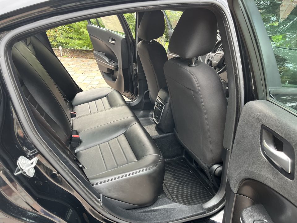 Black leather rear seats and door panel of a car