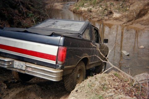 1992 Ford Bronco - This 1992 Ford Bronco is navigating a muddy stream bed during an off-road excursion.
